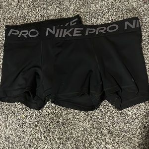 Brand is Nike, the size is XS for both, the color is black.